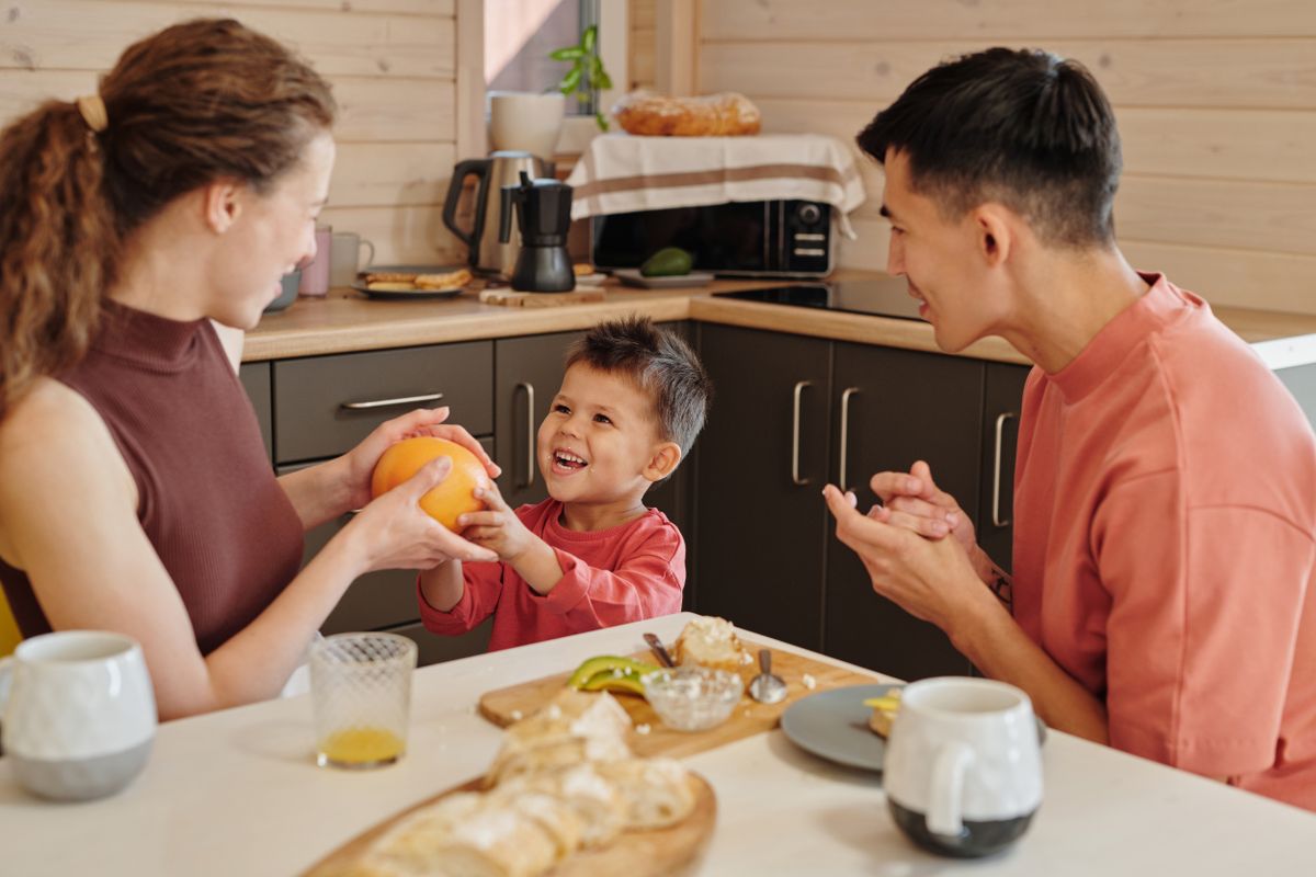Family sharing breakfast at home