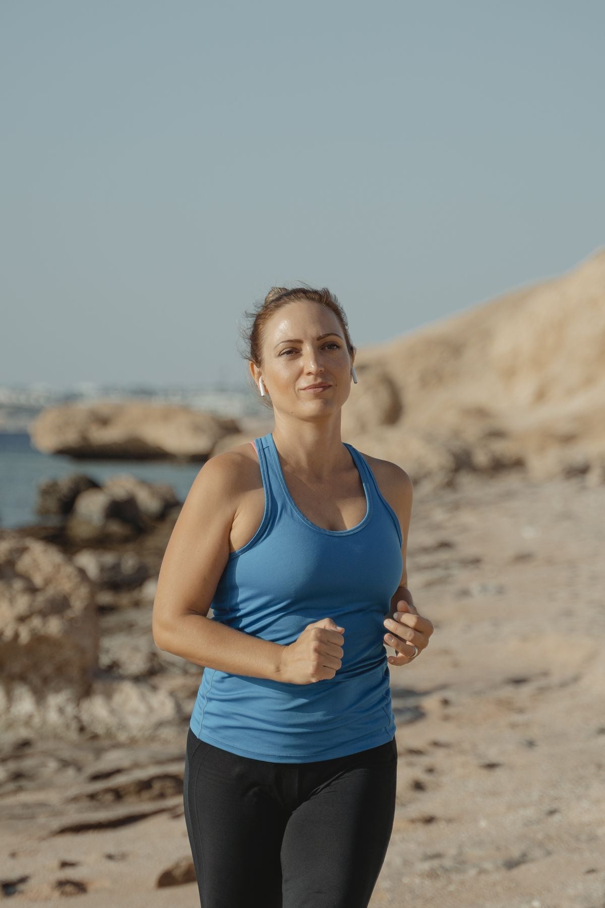Woman jogging near the shore